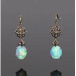 Opal and diamond set earrings, with a diamond set top and leaf design above the oval opal, 31mm