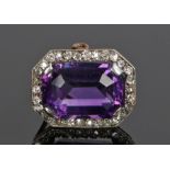 Victorian amethyst and diamond set brooch, the central emerald cut amethyst with a diamond surround,