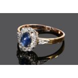 Sapphire and diamond set ring, the central cabochon sapphire at 0.35 carat having a diamond