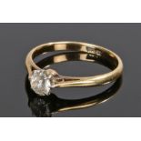 18 carat gold ring, set with a clear stone to the head, ring size O