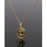 18 carat gold sphene and yellow diamond pendant necklace, with a central sphene with a diamond