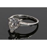 Fine platinum and diamond set ring, the central pear cut diamond at approximately 2.13 carats and