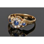 Sapphire and diamond set ring, with three round sapphires, the central sapphire with a diamond