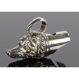 Silver whistle in the form of a dog head