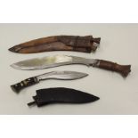 Two Nepalese kukri, both in leather scabbards, (2)