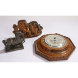 Oak cased barometer with silver coloured dial, soapstone carving depicting a monkey and birds beside