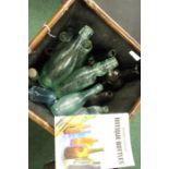 Collection of 19th and 20th century glass bottles, together with a book on antique bottles by Edward