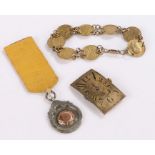 Jewellery, to include an Art Deco watch dial and movement, a silver medal and a coin bracelet, (3)