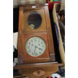 Edwardian walnut cased wall clock, the silvered dial with Arabic numerals, the case with oval