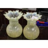 Pair of vaseline glass vases, the wavy rims above bulbous bodies with spot and swirl decoration,