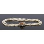 Pearl necklace, the three strands of tapering pearls attached to the clasp end, 45cm long