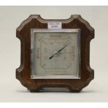 SB barometer with silvered dial, mounted in a shaped oak frame, 20.5cm square