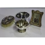 Silver, various dates and makers, to include a dish on stand, a twin handled bowl, a brush and a