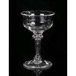 Sweetmeat glass, the waisted bowl supported on a teared plain knopped stem and above a domed,