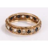 9 carat gold eternity ring, set with sapphires and cubic zirconia