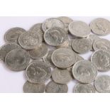 Sixteen King George V and King George VI shillings, fourteen King George VI two shilling coins (