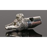 Silver whistle in the form of a dog head