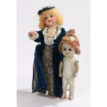 Two bisque porcelain dolls, the first with a blue dress, 20cm high, the second with no clothing,