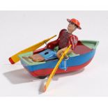 Tin plate clockwork, figure in a rowing boat, made in China