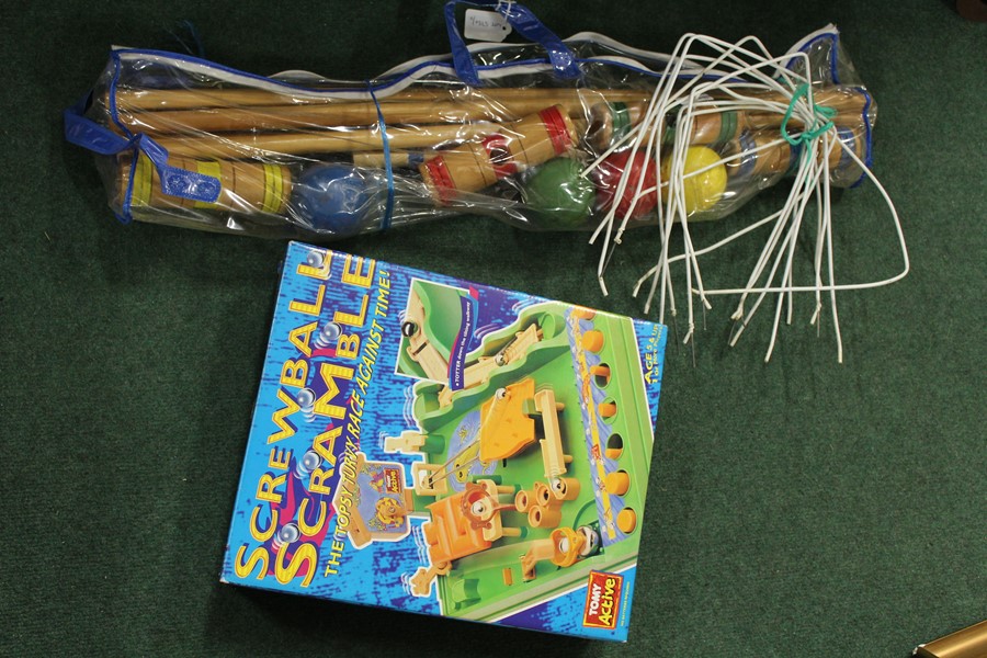 Small size croquet set, together with a boxed Screwball Scramble game, (2)