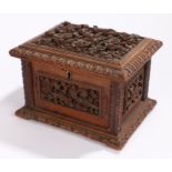 19th century Black Forest jewellery casket, deeply carved with flowers and branches, conforming