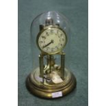 German anniversary clock, the brass clock with floral swag decorated dial under a glass dome