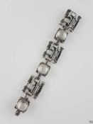 Armband mit Bergkristall - 835er Silber, unregelmäßig geformte teils durchbrochene Glieder, Besatz
