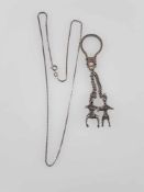 Erotischer Schlüsselanhänger - vollplastische Mann- und Fraufiguren beim Liebesakt als Abhängungen