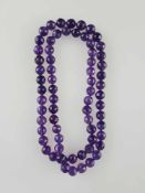 Amethystkette - Endloskette aus ca.68 facettierten Amethyst-Kugeln in Einzelknotung, Dm.ca.10,2mm,