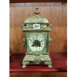 ANTIQUE BRASS CARRIAGE CLOCK WITH LION HEAD HANDLES