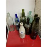 SHELF LOT OF ANTIQUE BEER BOTTLES