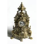 LARGE ANTIQUE BRASS CLOCK WITH TWO BRASS CANDLEABRAS (NOT MATCHING)