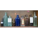 SHELF LOT OF CHEMIST BOTTLES