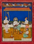 Maharana Karan Singh son of Raja Bishan Singh of Amer, in an open courtyard with attendants