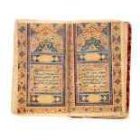Ɵ A Fine Pocket-Sized Qur'an, in Arabic, illuminated manuscript on paper [Qajar Persia, c. 1800 AD]