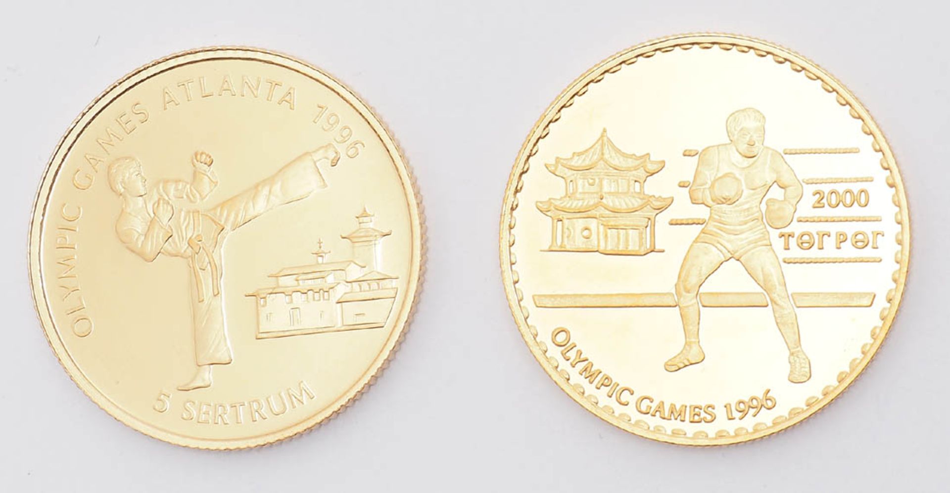 Zwei Goldmünzen, Olympiade 1996 Bhutan. In originaler Kassette. Gew. je ca. 7g.