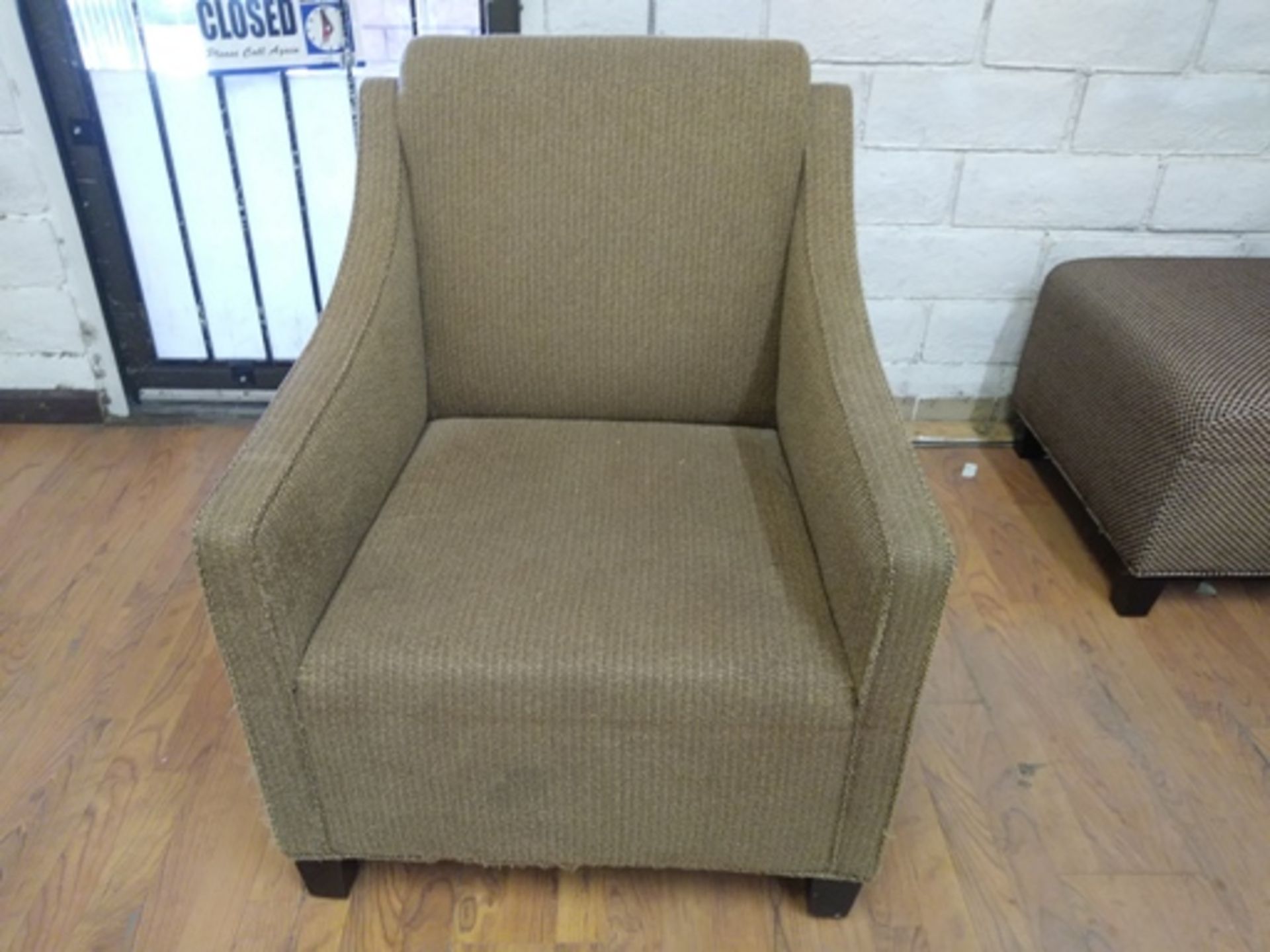 BROWN HEAVY ARM CHAIR