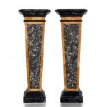 A pair of lumachella and giallo di Siena wall pedestals