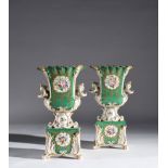 A pair of French polychrome porcelain vases