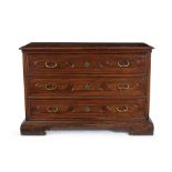 An Emilian walnut chest of drawers