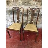 A pair of Victorian bedroom chairs on cabriole legs