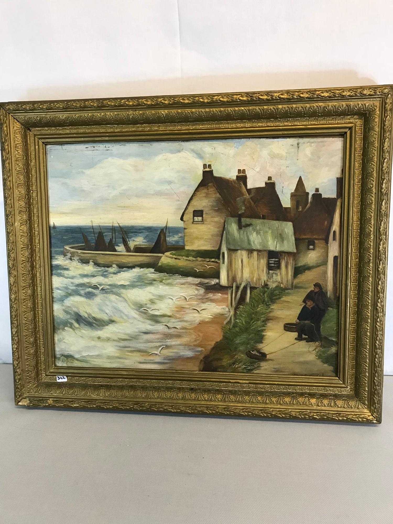 Coastal scene oil painting fitted in an ornate gilt frame