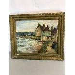 Coastal scene oil painting fitted in an ornate gilt frame