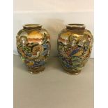 A pair of hand painted Satsuma vases