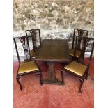 Solid oak Ercol extending table together with 4 high back chairs