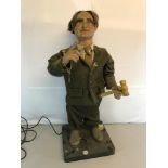 Vintage mechanized auctioneer figure wearing a tweed suit. working order