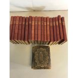 Collection of Charles Dickens books and Victorian photo album