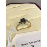 9ct gold ladies ring, set with a black spinel stone & CZ shoulders