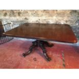 Large Victorian flip top dining table, supported on a single carved pedestal and 4 ornate legs