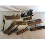 A Collection of vintage joiners planes to include Victorian 1871 brass and wood spirit level